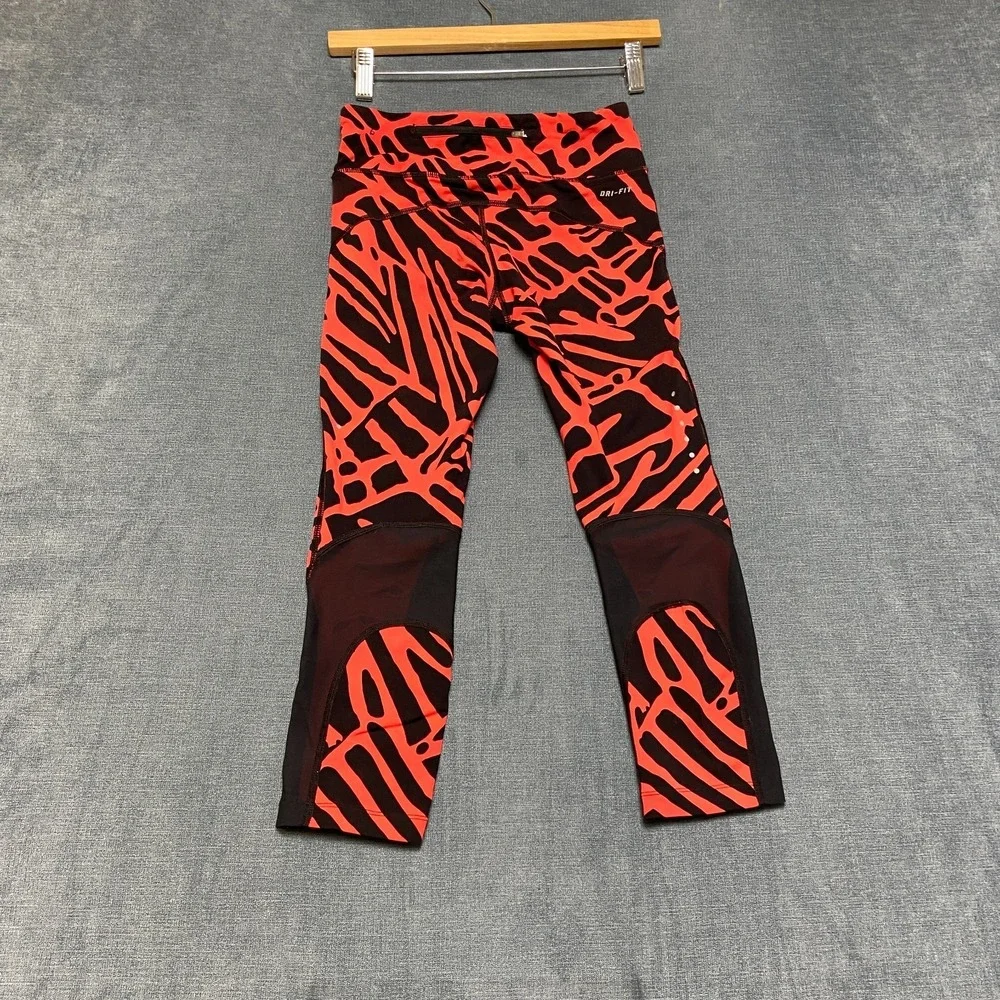 Nike Dri Fit Power Epic Lux Capri Leggings Womens XS Black Orange Abstract Print